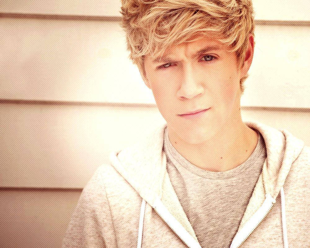 Niall Horan Jacket Smirk Illuminated Background