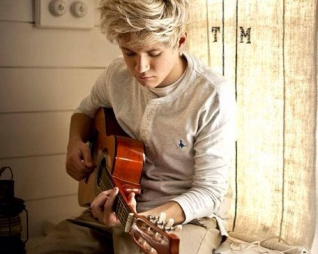 Niall Horan Playing Guitar Background