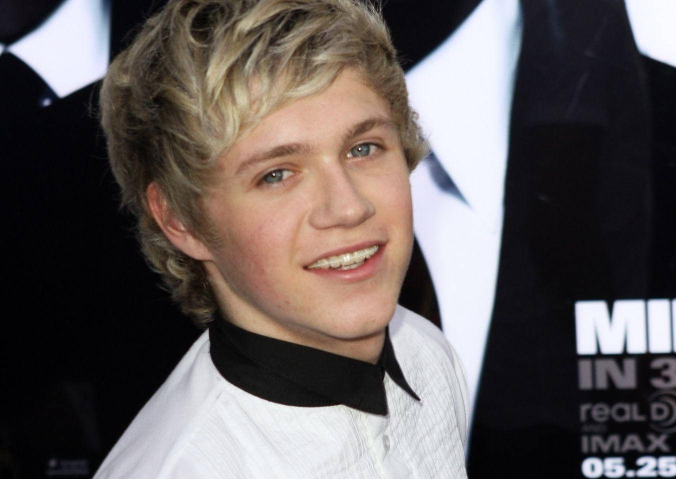 Niall Horan Side Look Braces Background