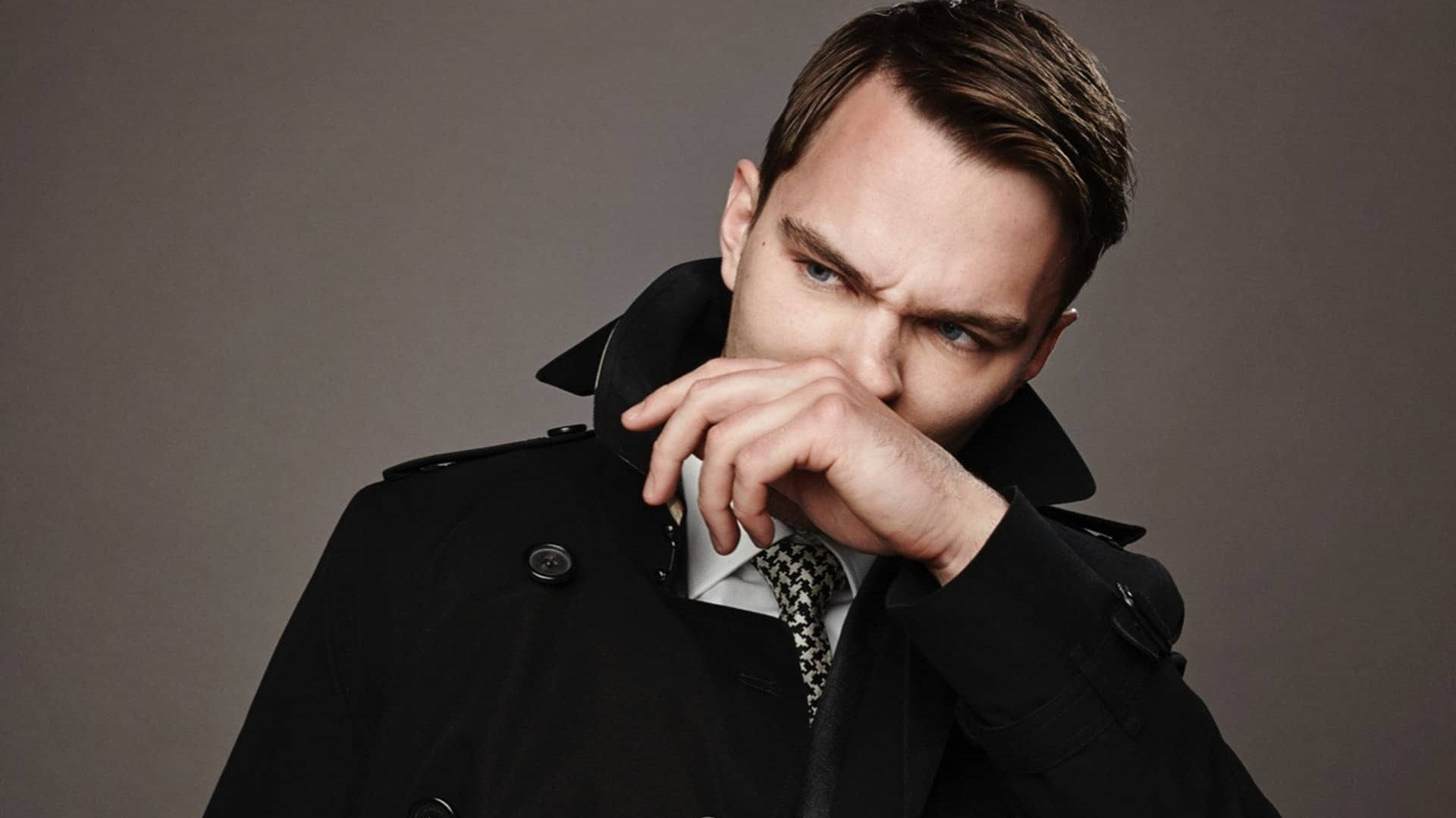 Nicholas Hoult Brushing Nose Background