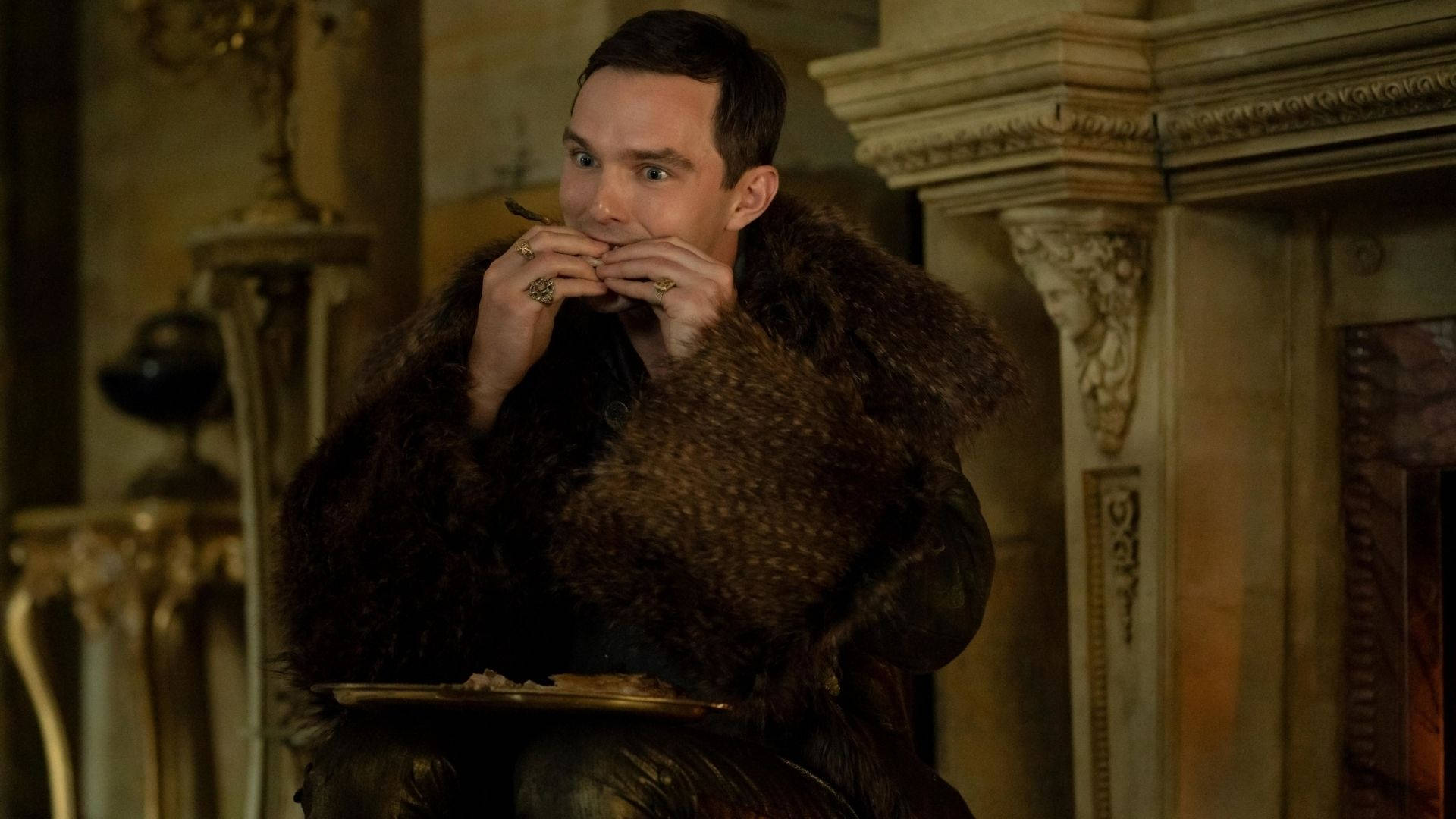 Nicholas Hoult Hungrily Eating Background