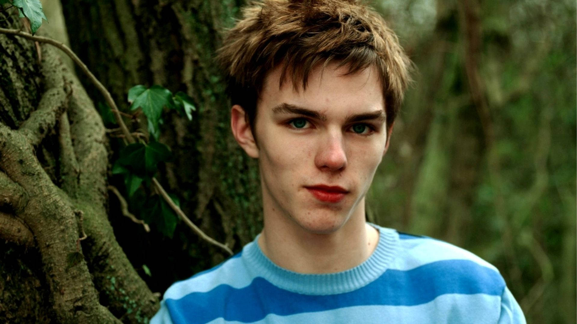 Nicholas Hoult In The Forest Background