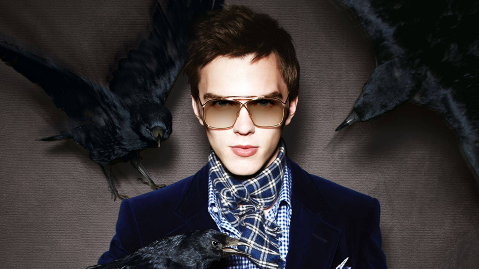 Nicholas Hoult Looking Dapper In Stylish Outfit Background