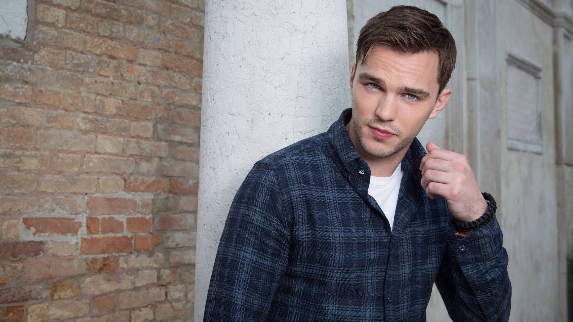 Nicholas Hoult Looking Handsome In A Fitted Suit Background