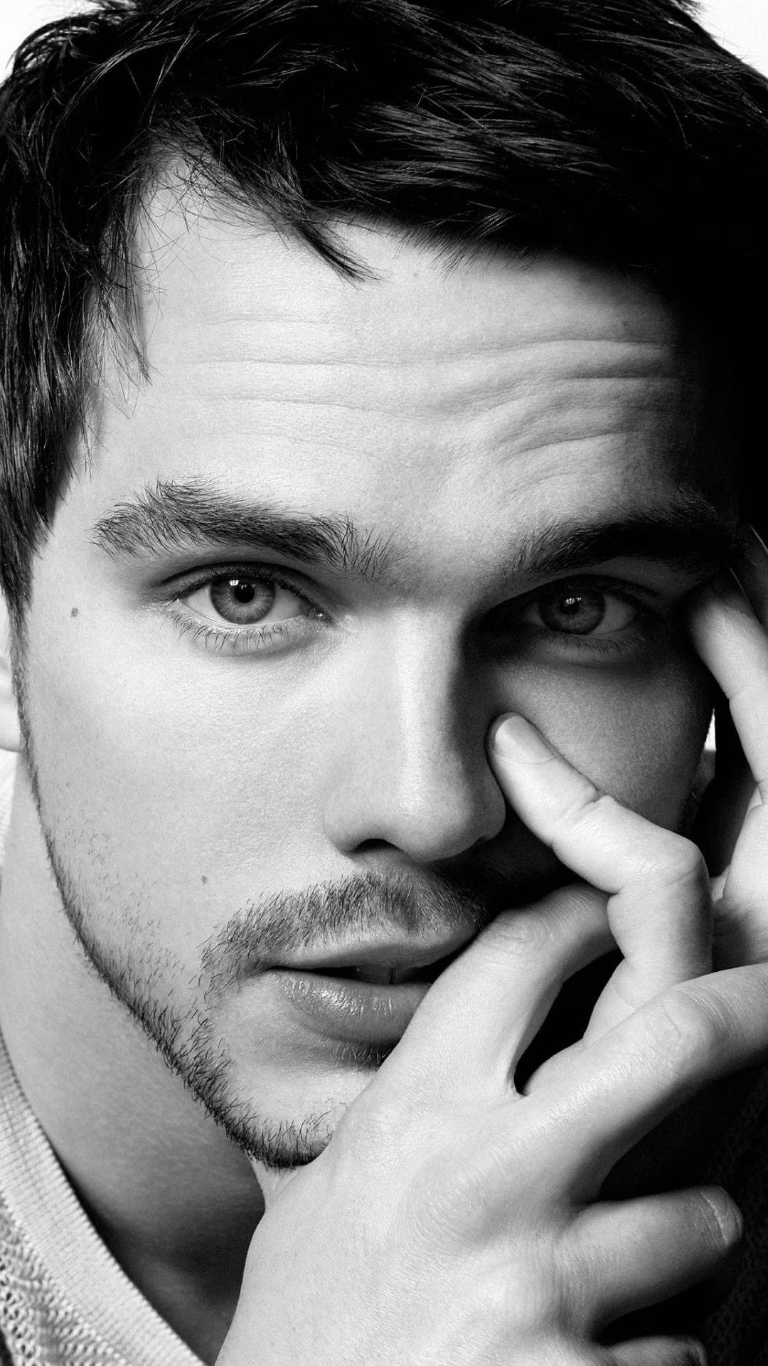 Nicholas Hoult Staring Beautifully Background