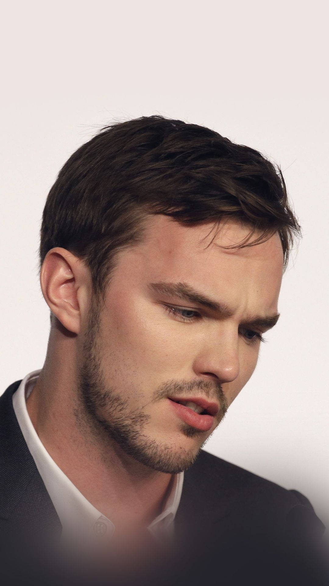 Nicholas Hoult Staring Down Background