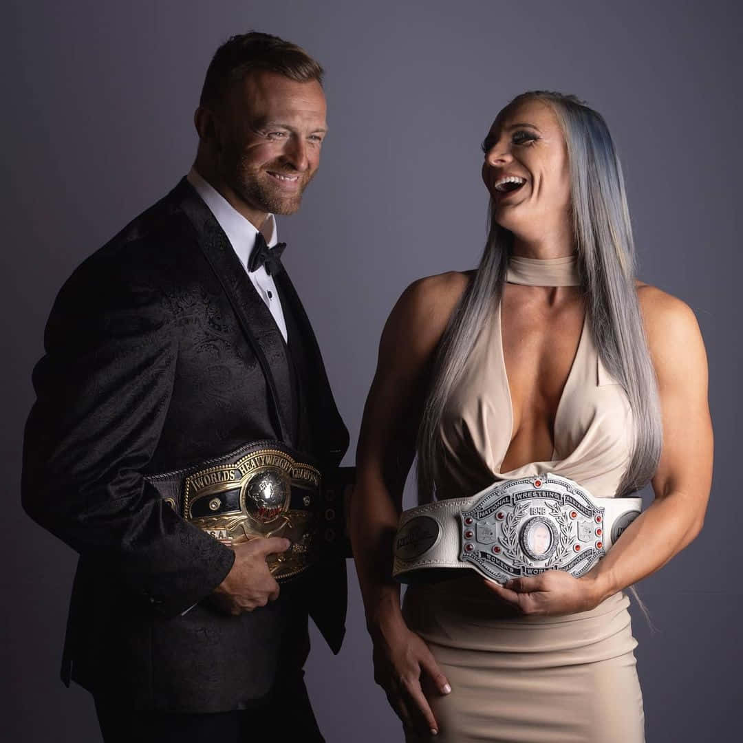 Nick Aldis And Kamille In Formal Attire