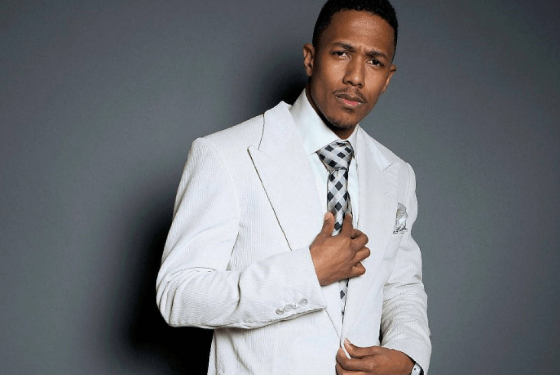 Nick Cannon Fixing Tie Background