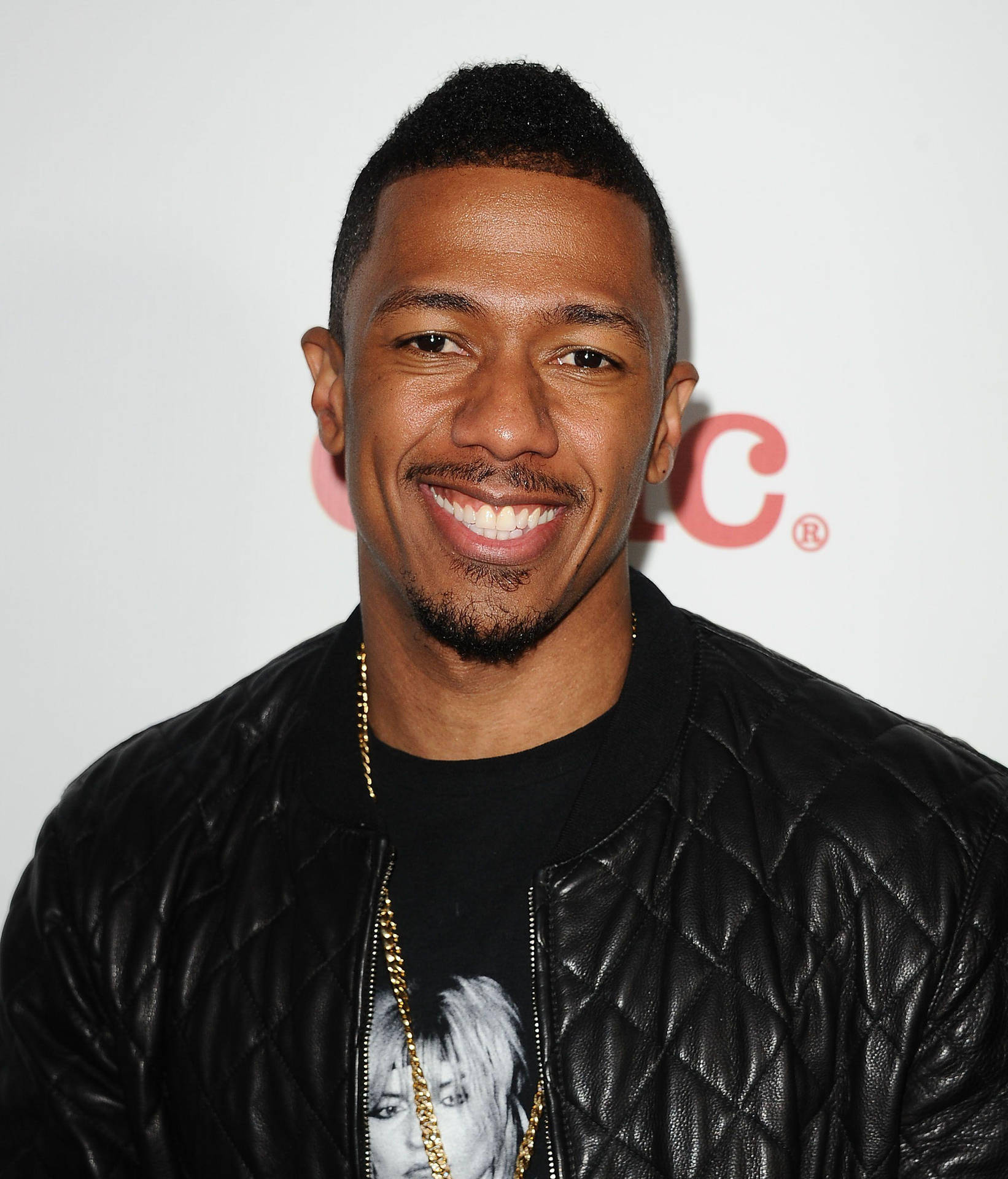 Nick Cannon Smiling At Camera Background