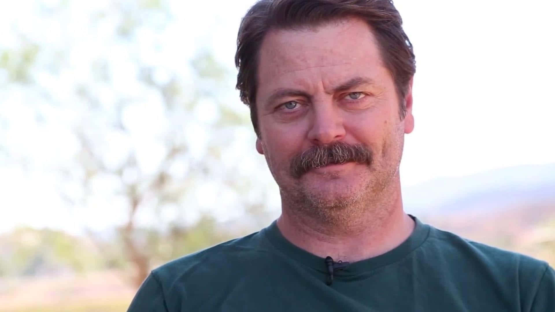 Nick Offerman Looks On In An Environment Of Nature And Peace. Background