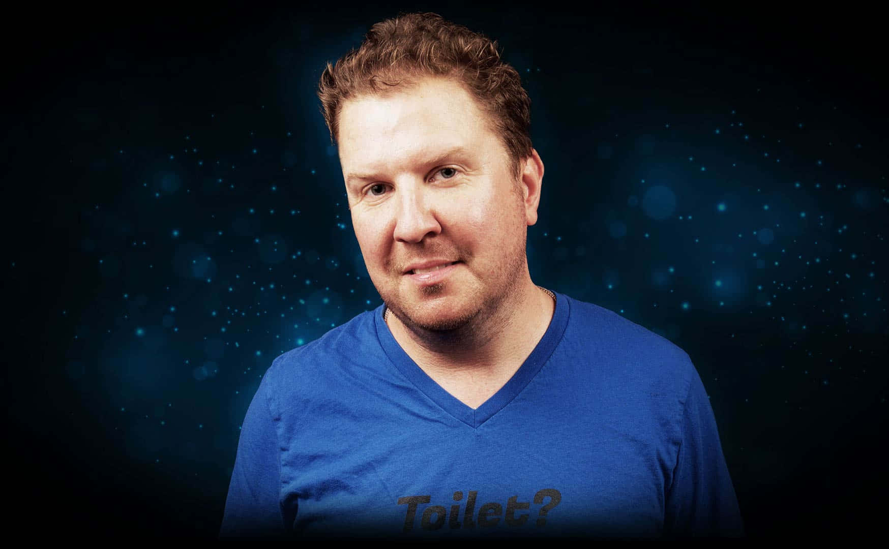 Nick Swardson Laughing On Stage Background