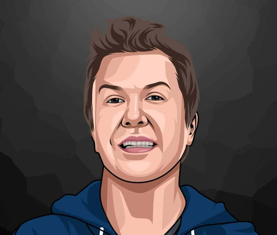 Nick Swardson Stands Confidently Wearing A Blue Suit Background