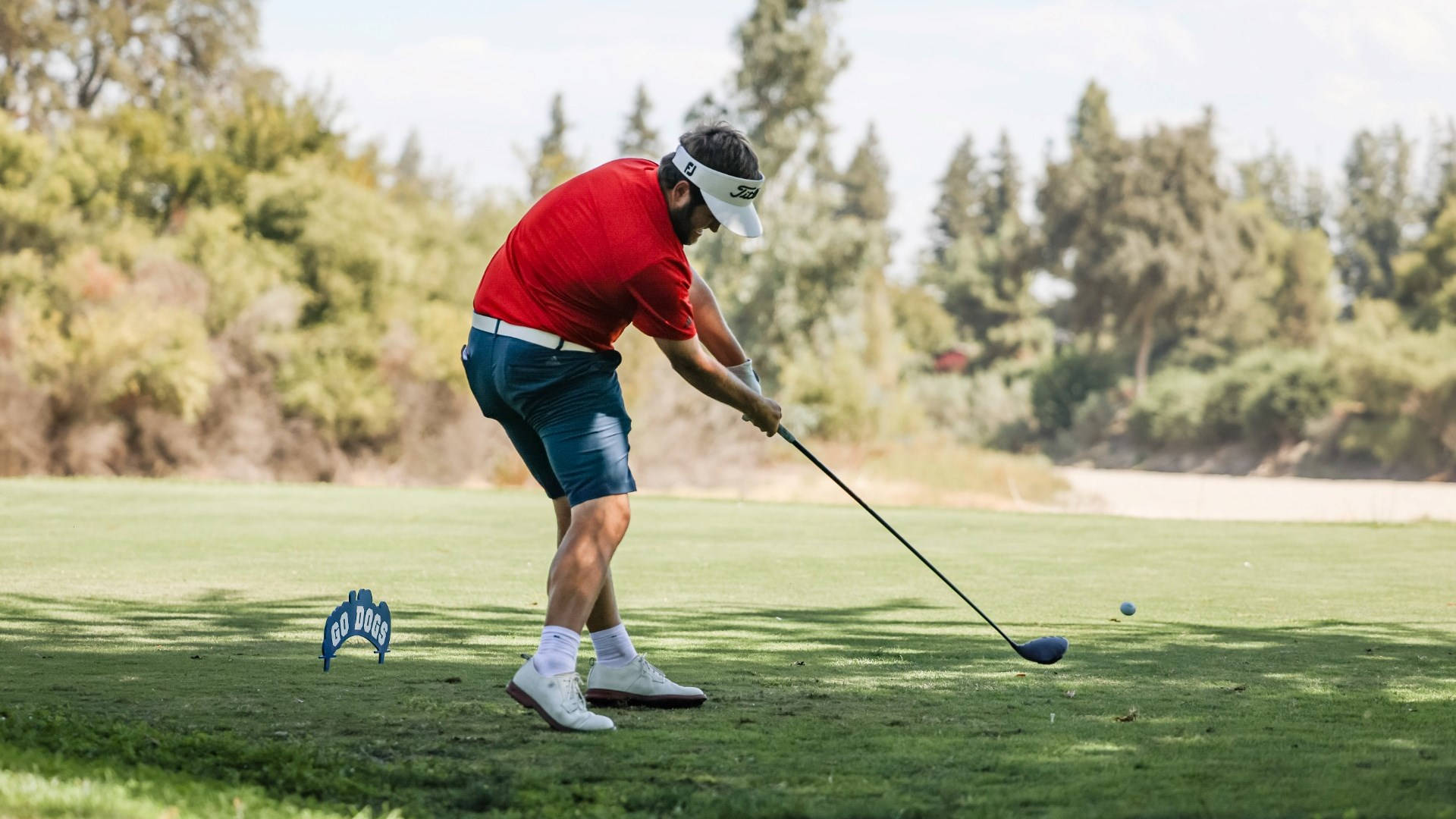 Nick Watney Intently Focusing On His Next Shot On The Golf Course Background