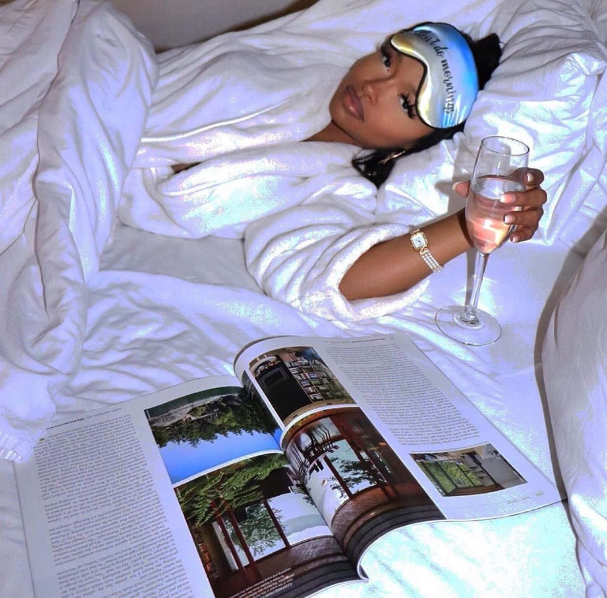 Nicki Minaj - A Woman In Bed With A Magazine Background