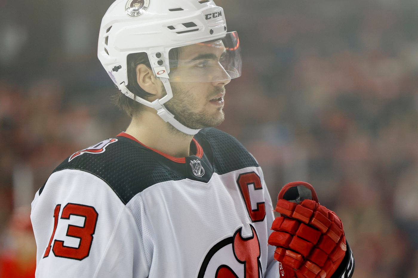 Nico Hischier Displaying Intensity On Ice Background