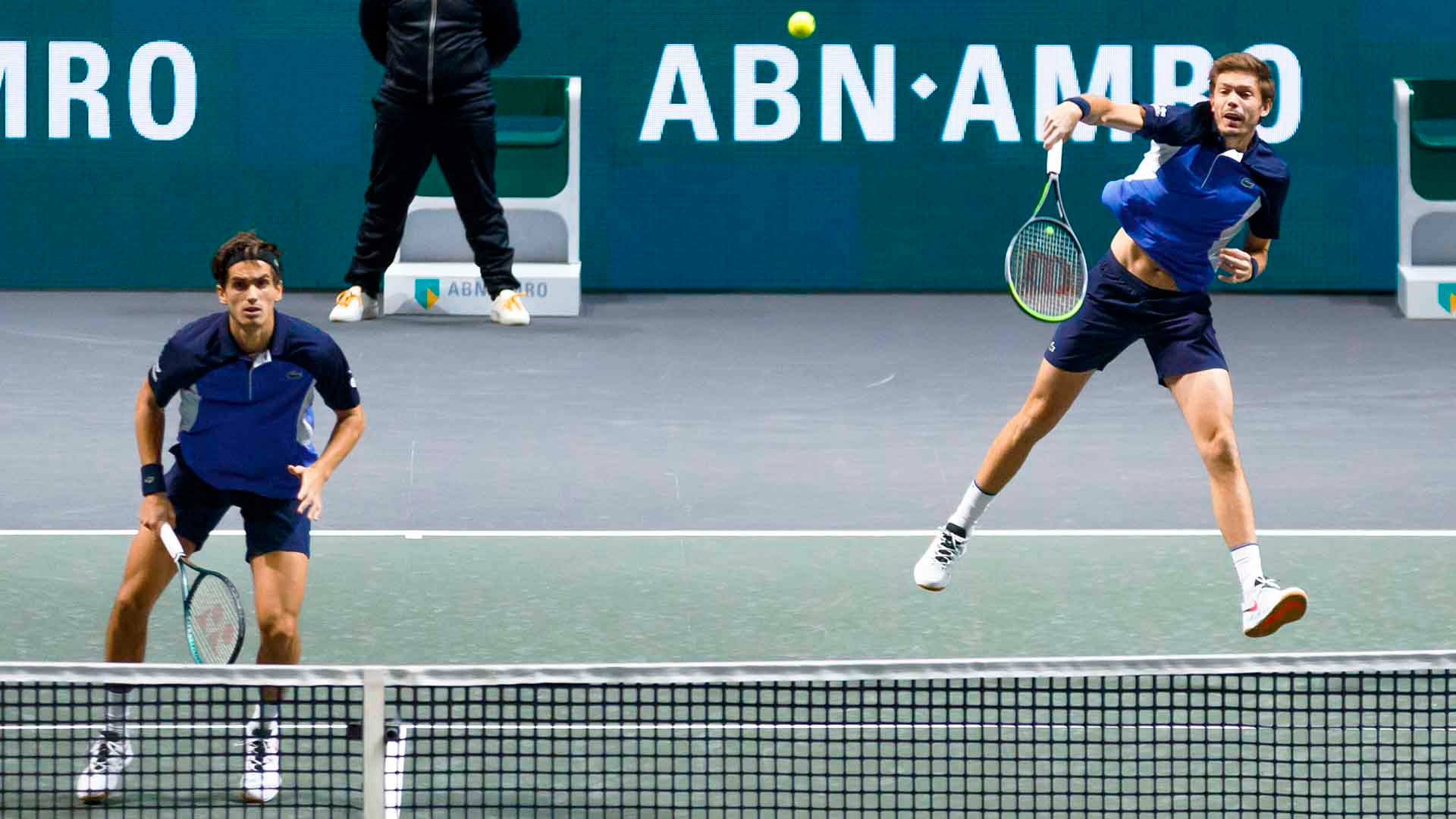 Nicolas Mahut In Action At The 2018 French Open Background