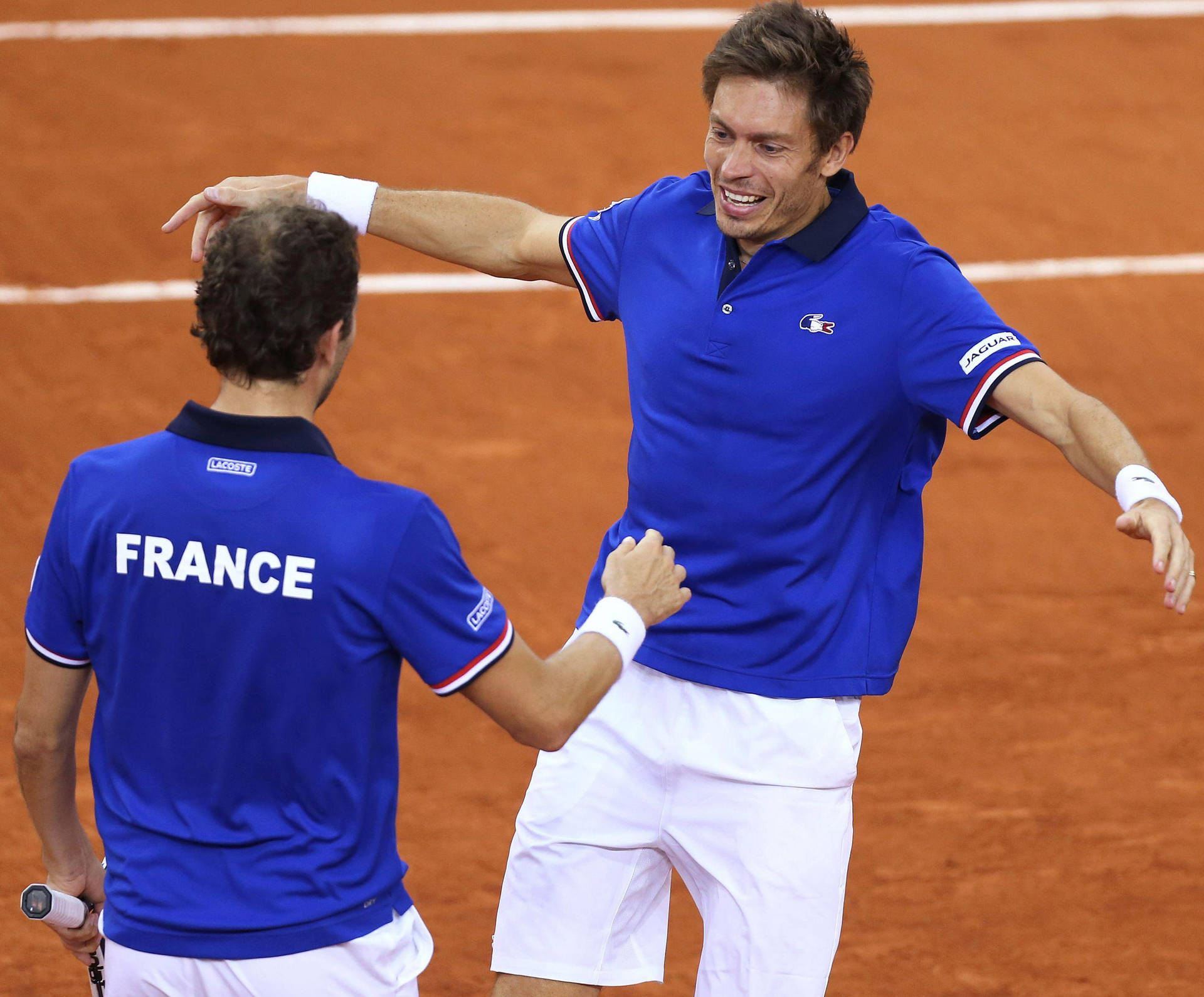 Nicolas Mahut In Action During A Competitive Tennis Match