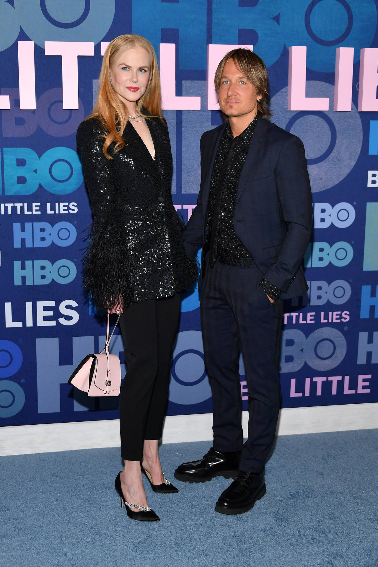 Nicole Kidman Styling In A Timeless Moynat Clutch. Background