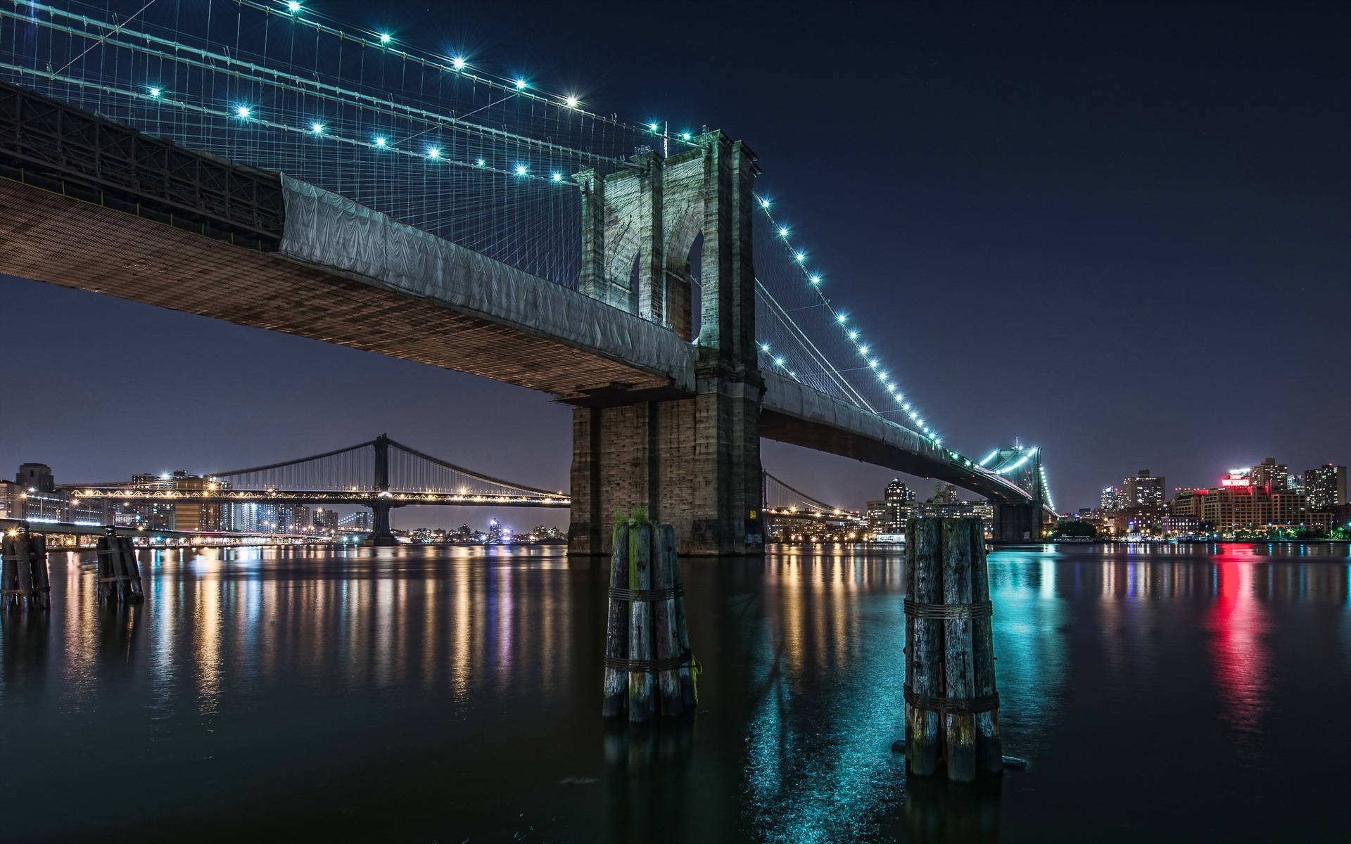 Night Shot Of The Brooklyn Bridge Background