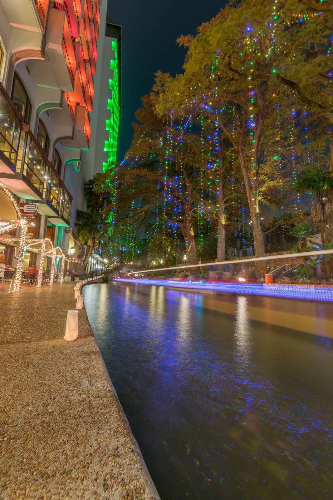 Night-time Festivity At San Antonio River Walk Background