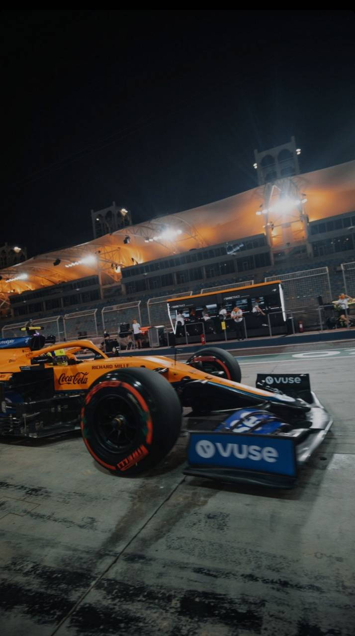 Night-time Passion: Daniel Ricciardo Behind The Wheel Of His F1 Car Background