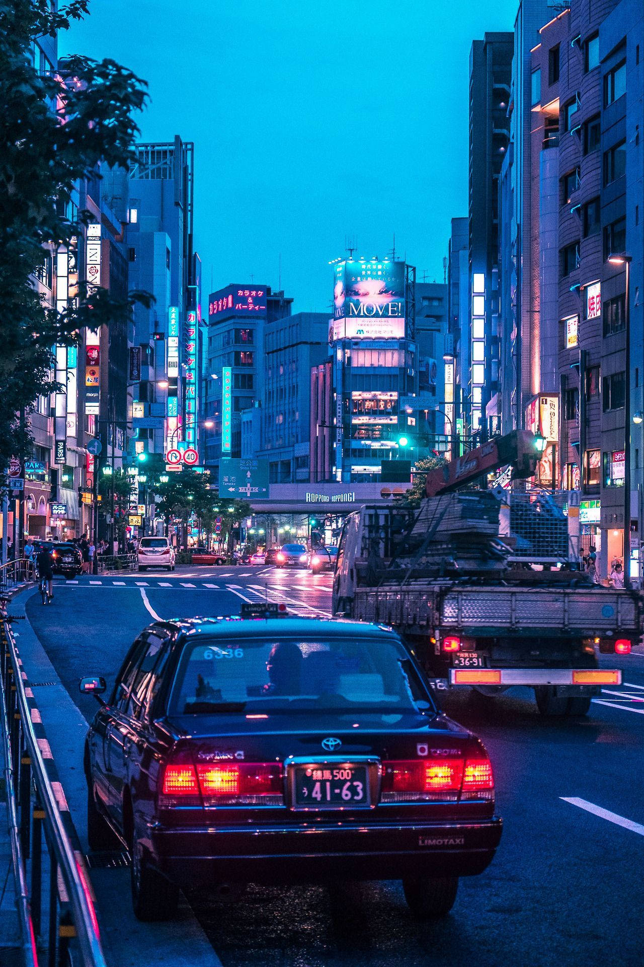 Nightlife Aesthetics: Jdm Car Illuminating The Tokyo Streets Background