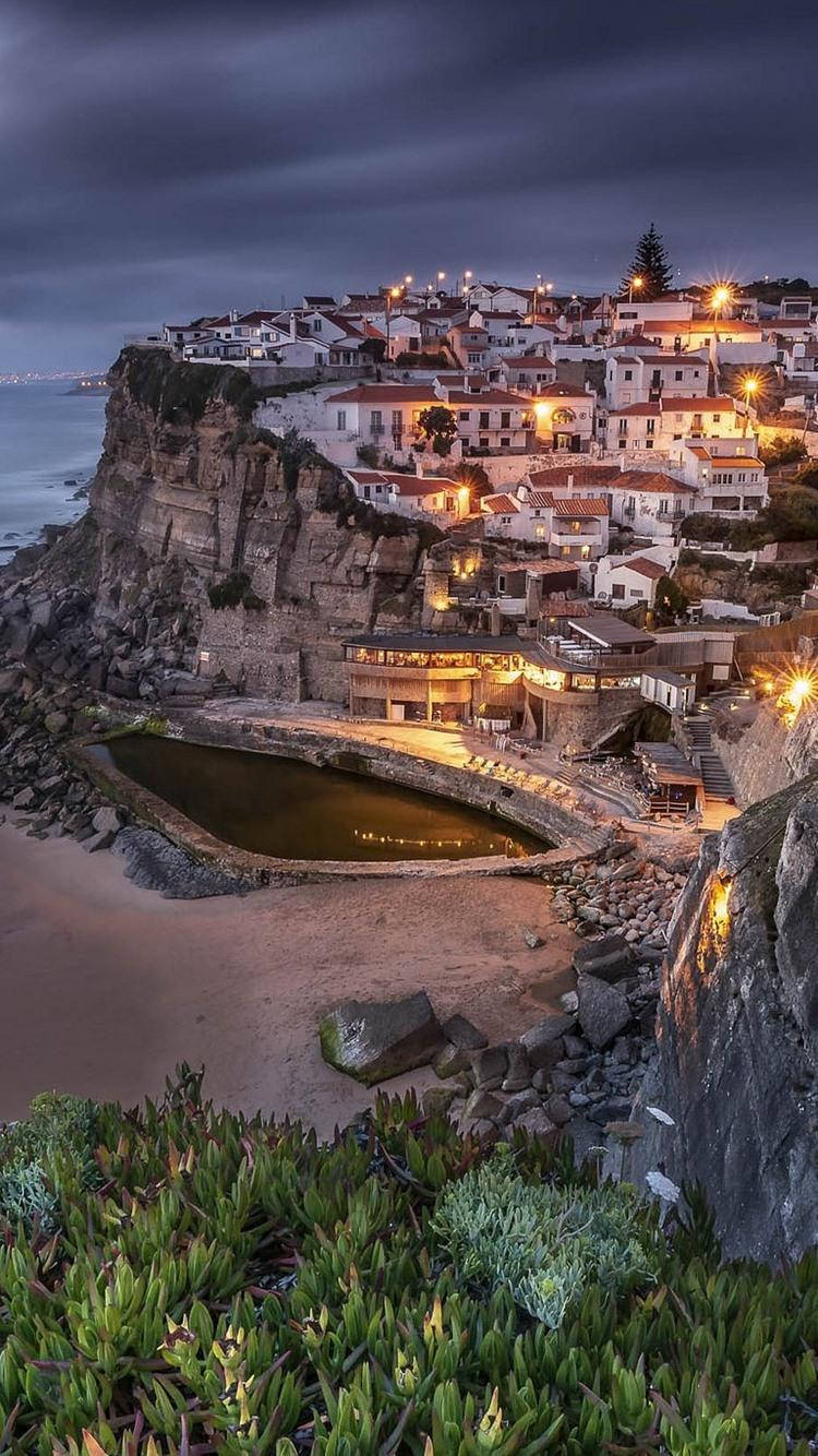 Nighttime Azenha Do Mar Beach Sintra Background