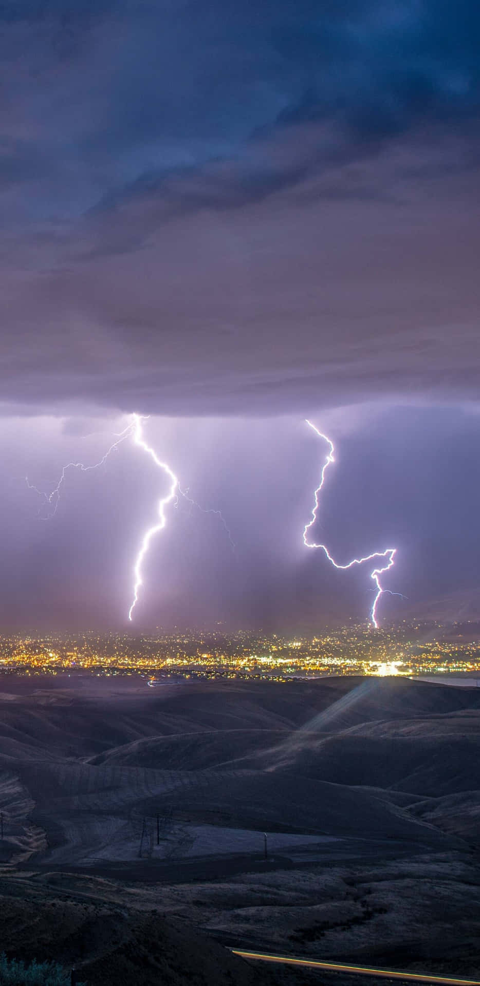 Nighttime Lightning Strike Over Cityscape