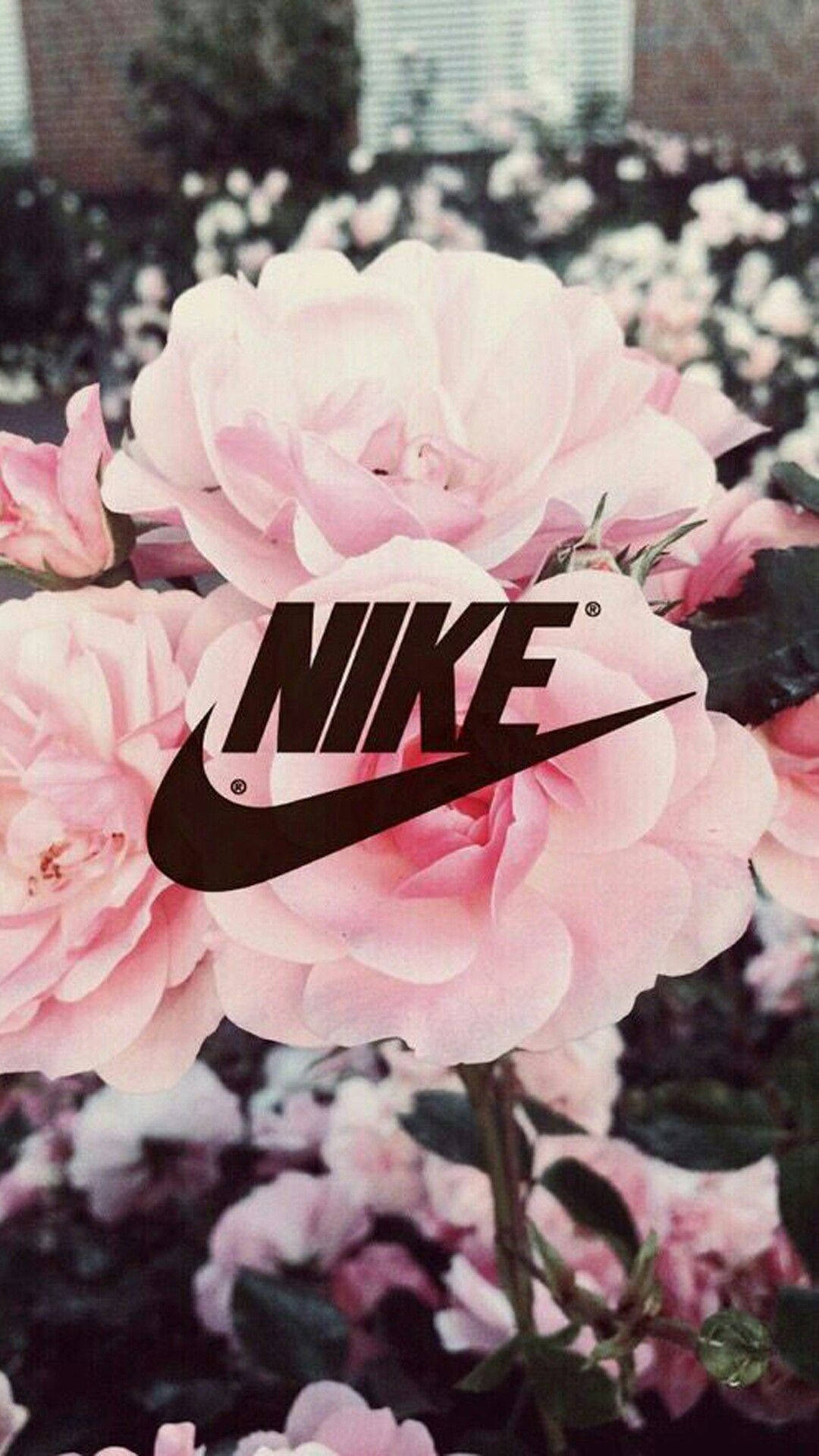 Nike Girl Logo Over Pink Roses Background