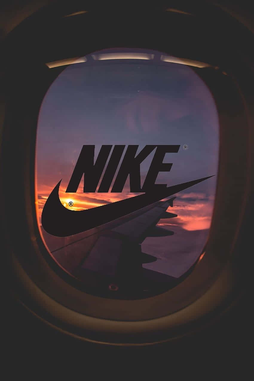 Nike Logo In The Window Of An Airplane Background