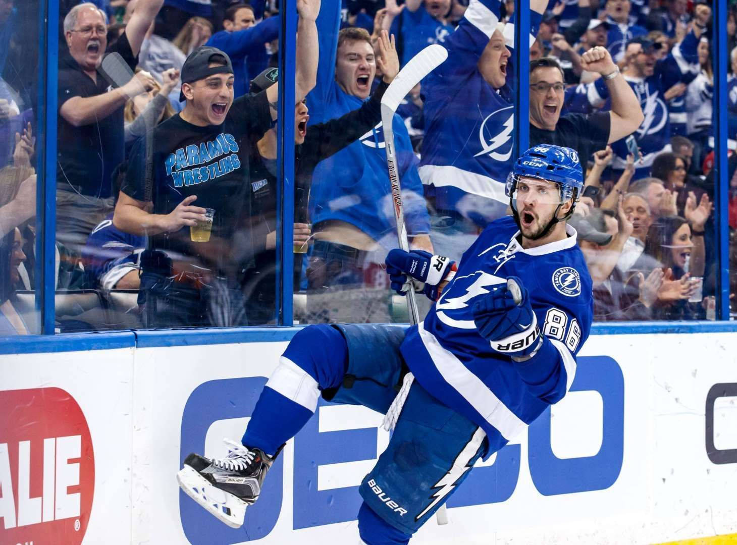 Nikita Kucherov Jubilantly Celebrating Victory On The Ice Background