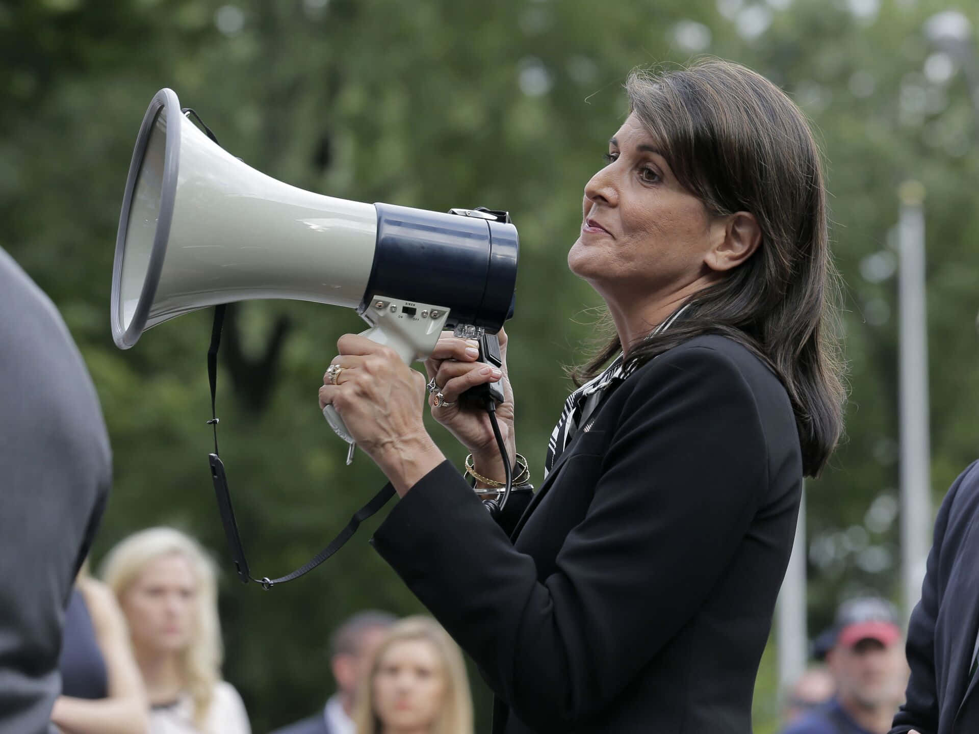 Nikki Haley Addressing Crowd With Megaphone Background