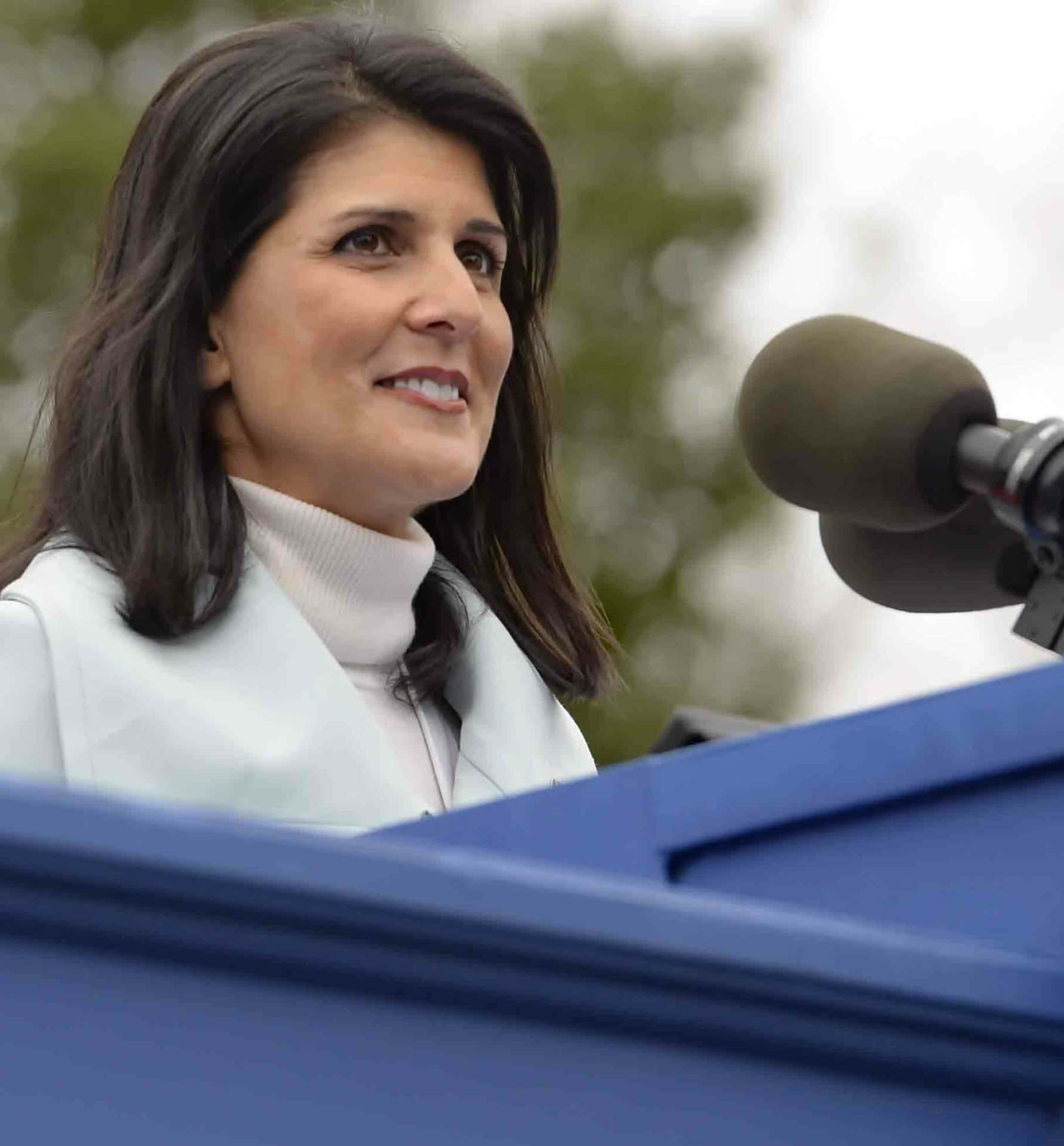 Nikki Haley In A White Turtleneck Background