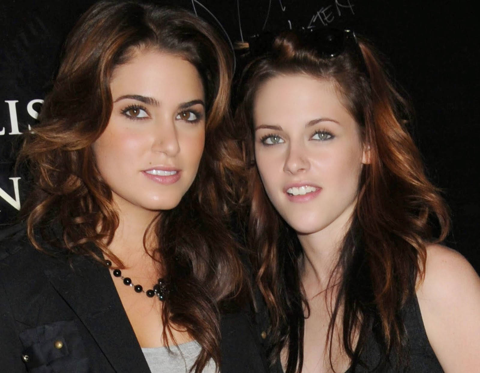 Nikki Reed And Kristen Stewart Eye-catching Portrait Background