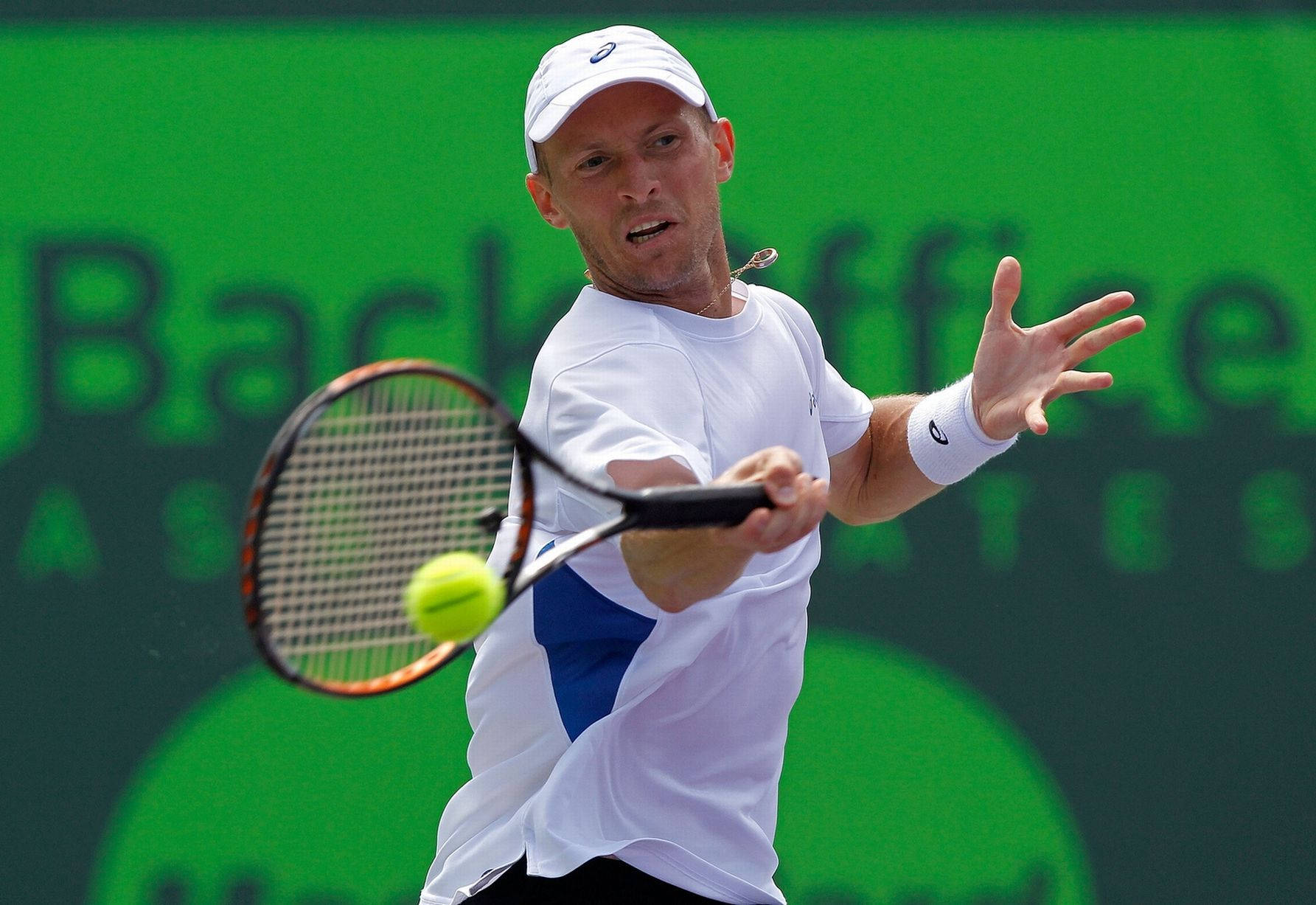 Nikolay Davydenko Executing A Precise Forehand Shot In A Tennis Match. Background