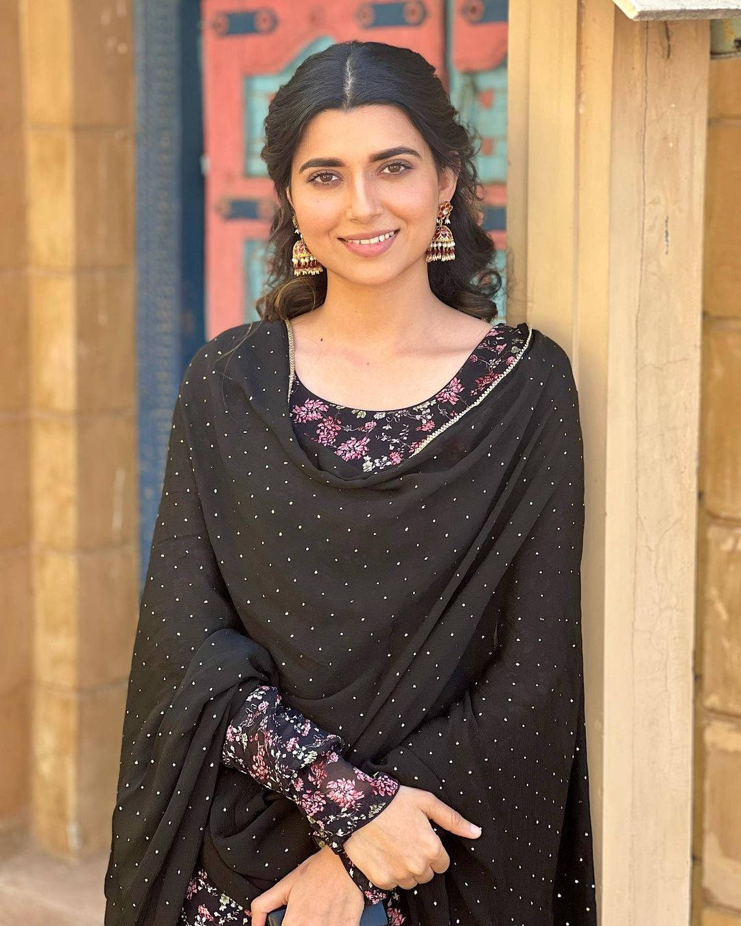 Nimrat Khaira By A Door Background