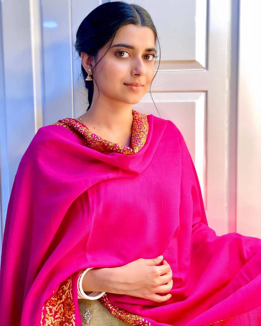 Nimrat Khaira Fuchsia Background