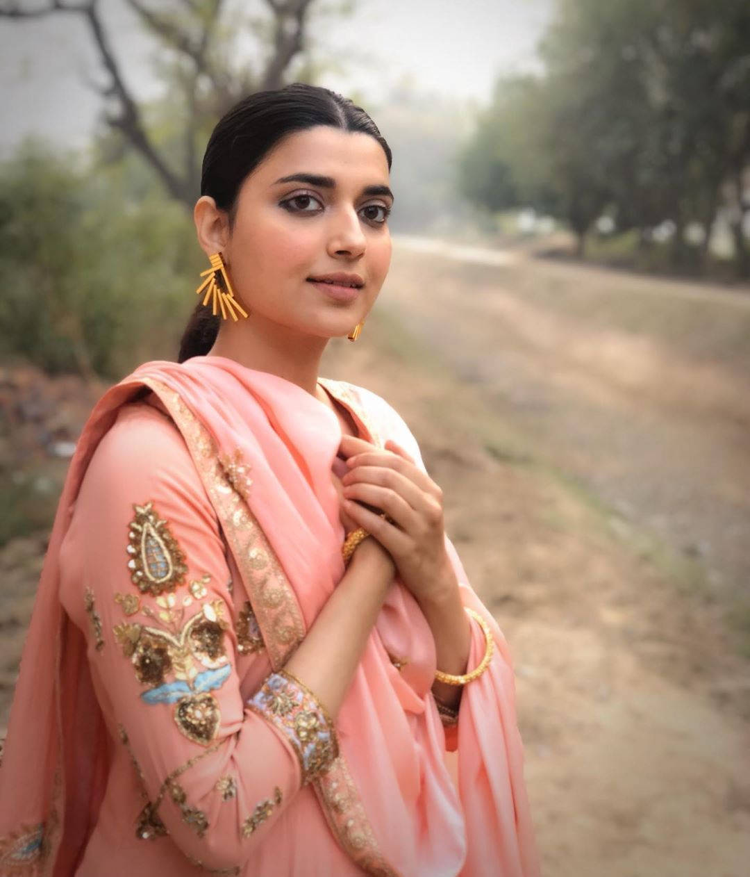 Nimrat Khaira Hands Over Heart Background