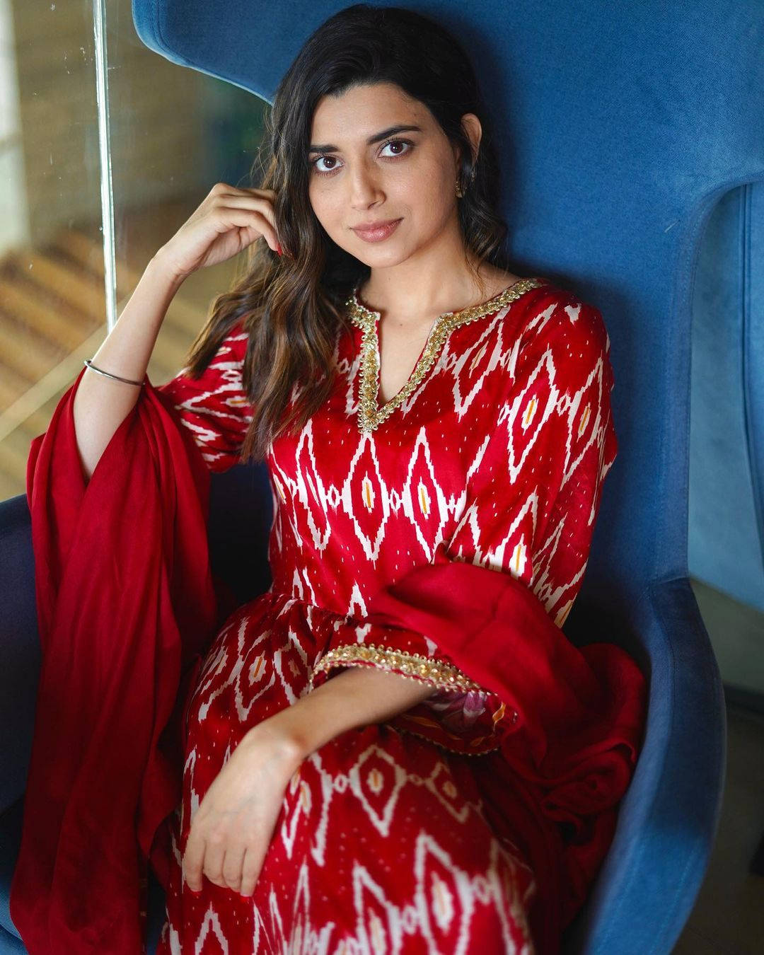 Nimrat Khaira Seated Background