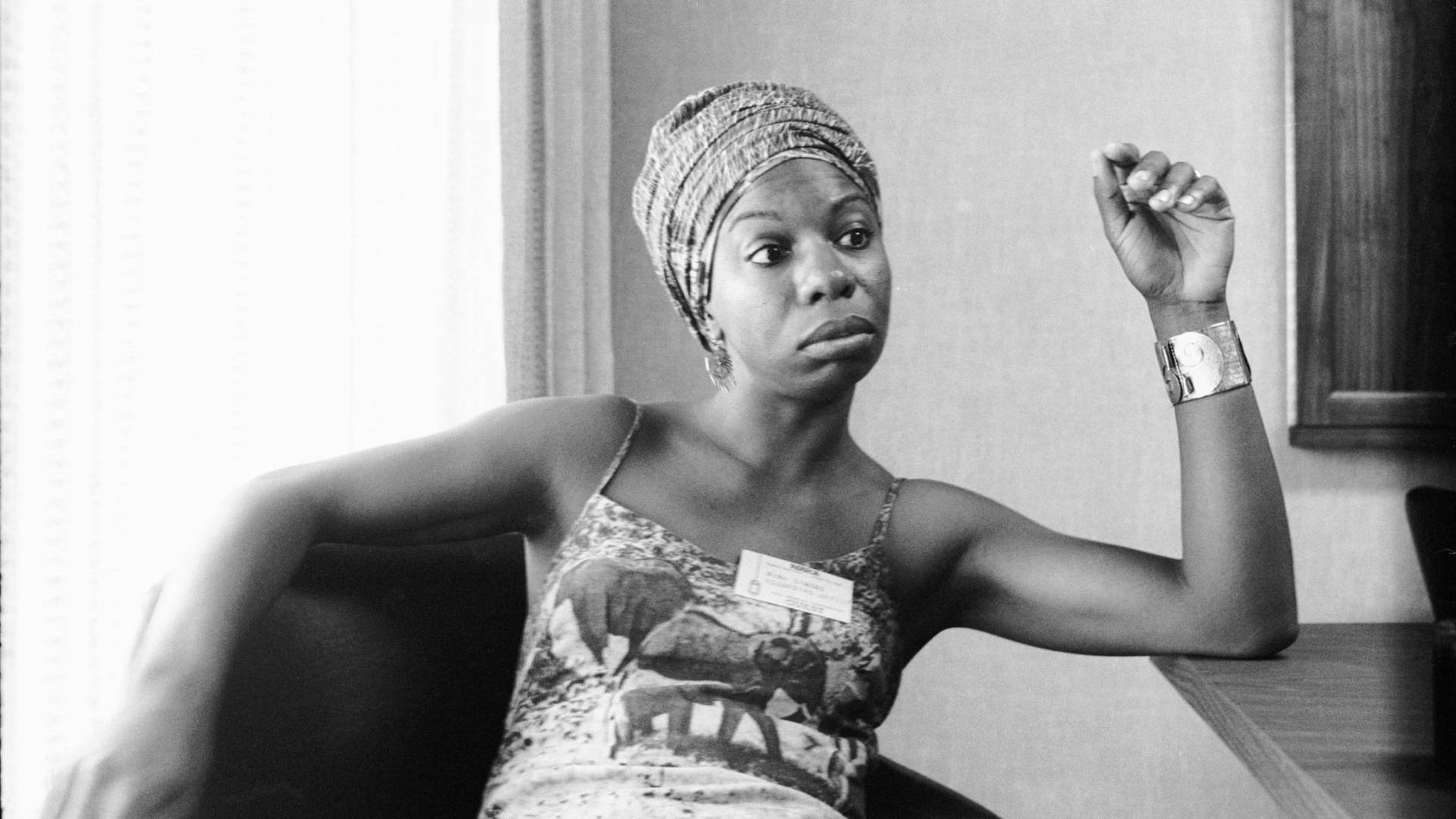 Nina Simone American Singer Confident Pose Background