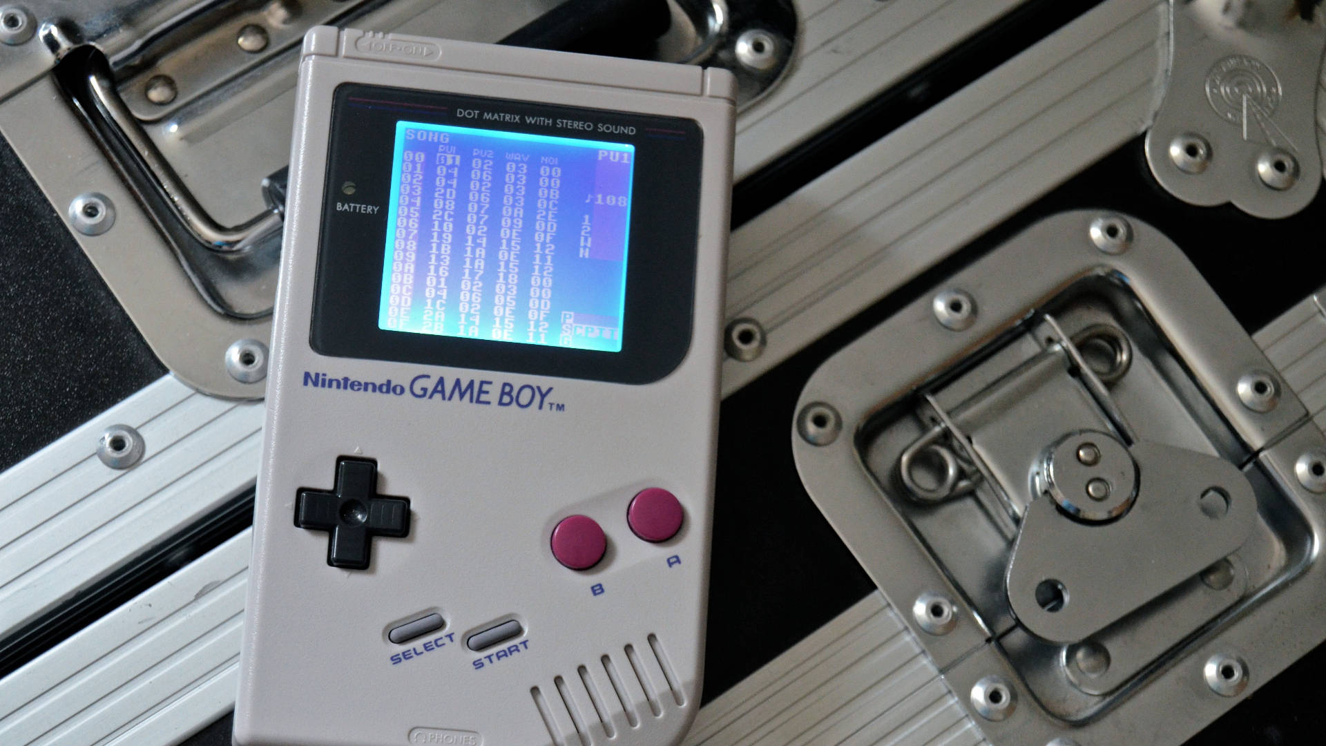 Nintendo Game Boy On Steel Floor Background