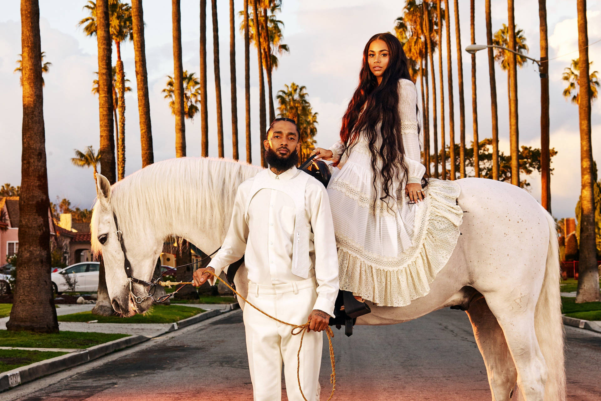Nipsey Hussle With Partner Background