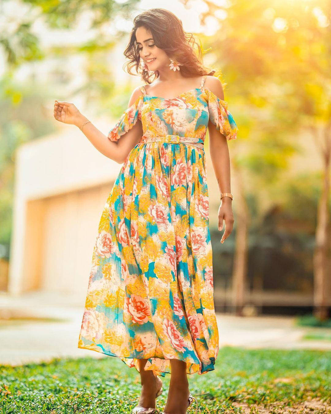 Nisha Guragain Captivating In Yellow Floral Dress Background