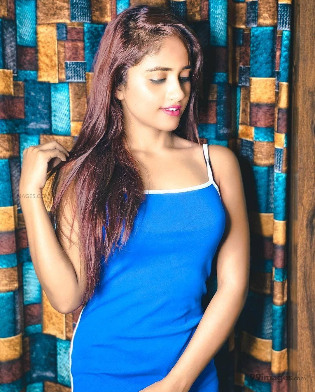 Nisha Guragain In Blue Sleeveless Top Background