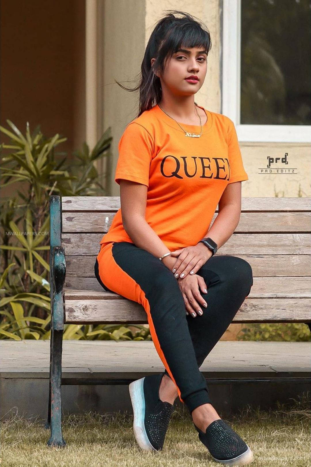Nisha Guragain In Orange Queen Top Background