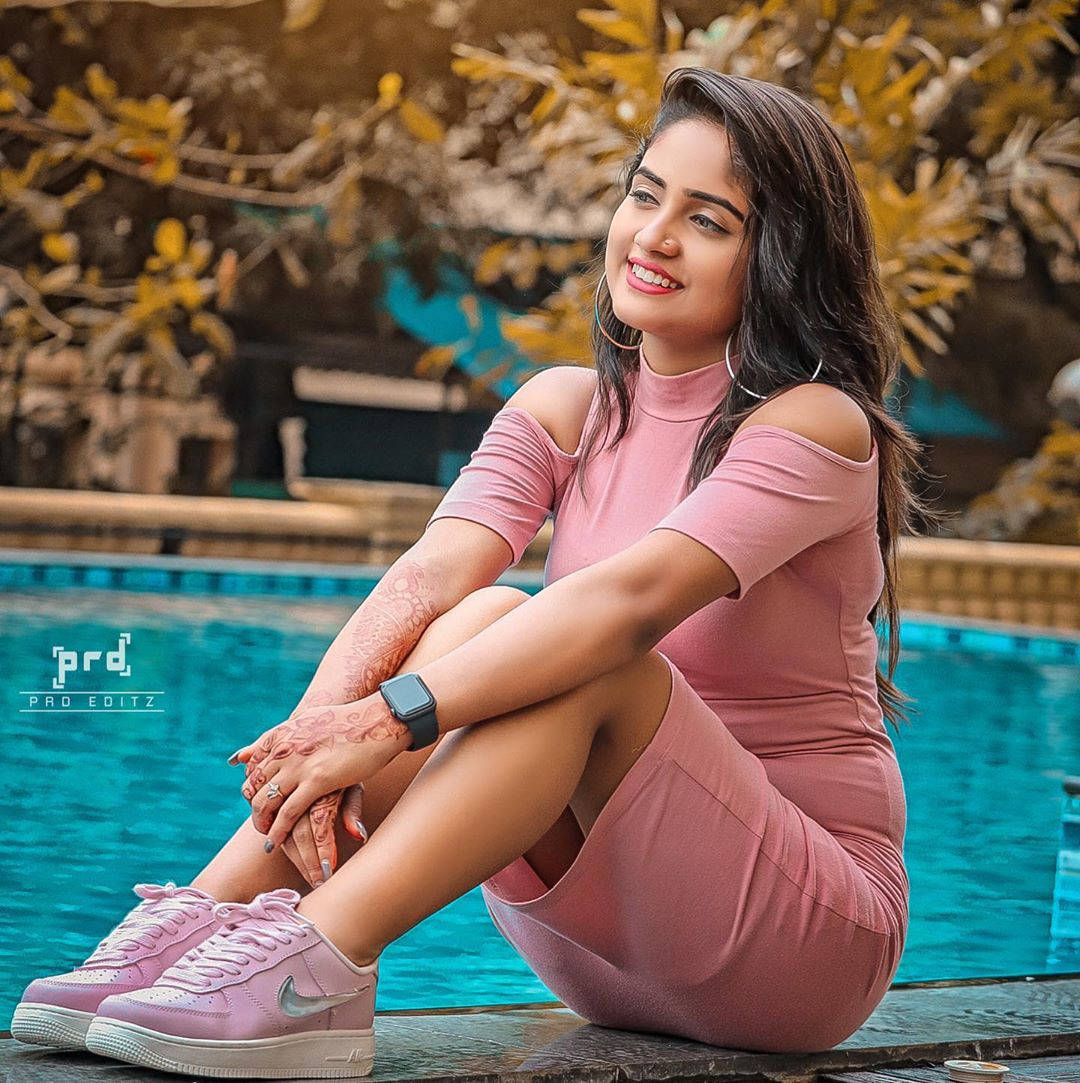 Nisha Guragain In Pink Outfit Background