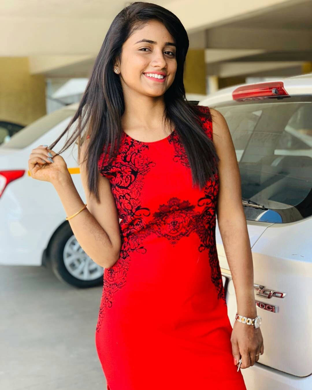 Nisha Guragain Wearing A Red Dress Background