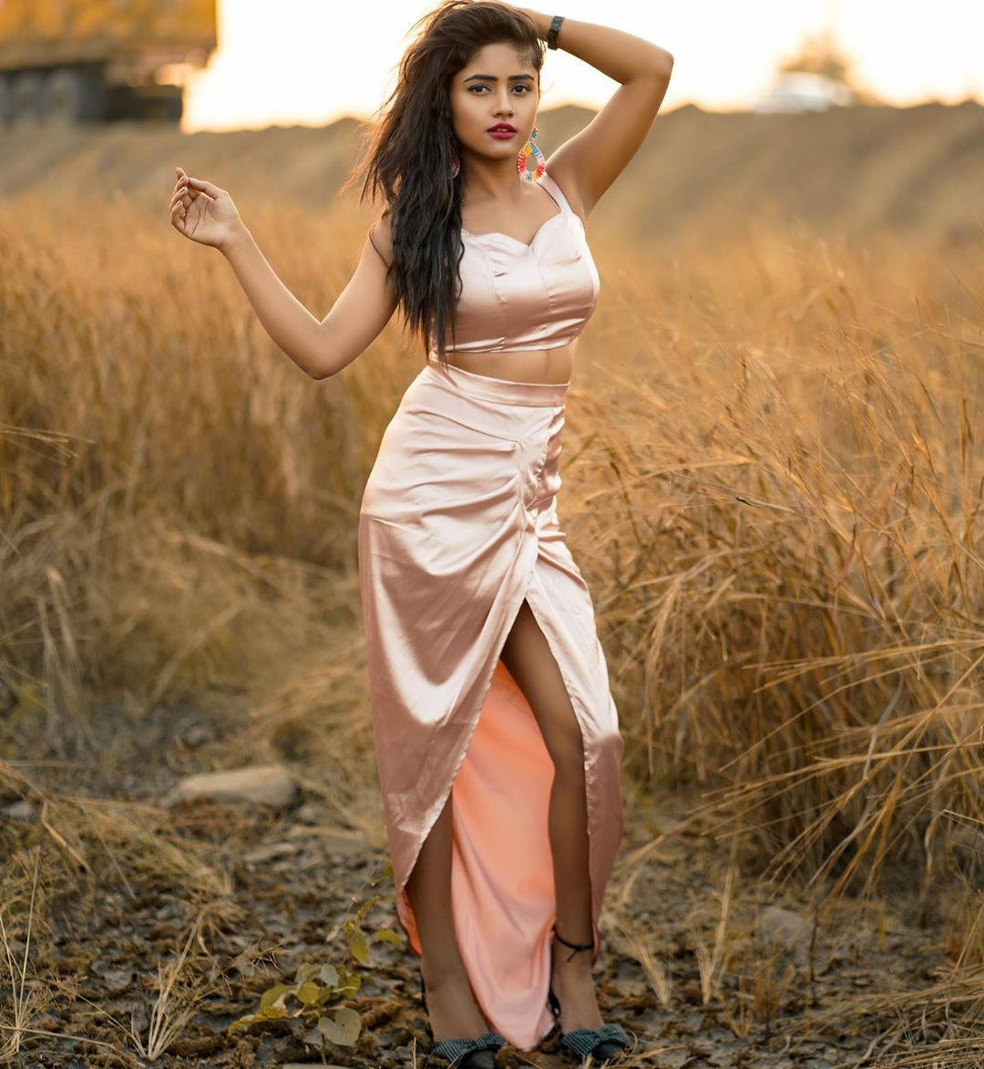 Nisha Guragain Wearing Silky Champagne Dress Background