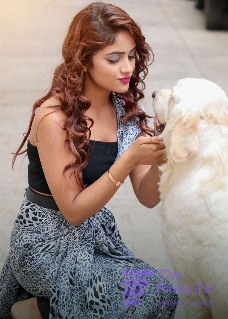 Nisha Guragain With A White Dog Background