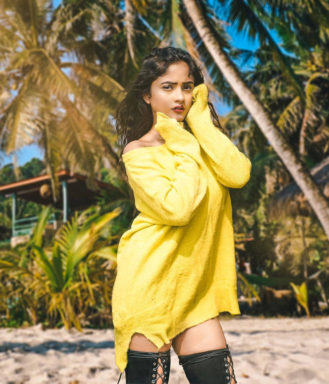 Nisha Guragain Yellow Dress Black Boots Background